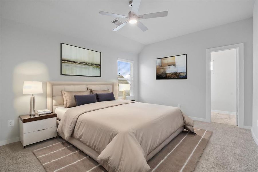 Secondary bedroom features plush carpet, custom paint, ceiling fan with lighting and large windows with privacy blinds.