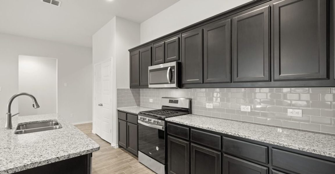 Representative exterior photo of a completed home built from the Boston by Impression Homes in Baker Farms, Cleburne, TX (Image 7).