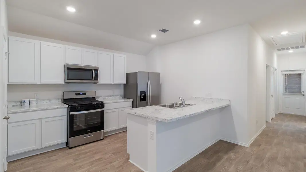 Furnished interior view inside a new home in Valverde, Bastrop (Image 5).
