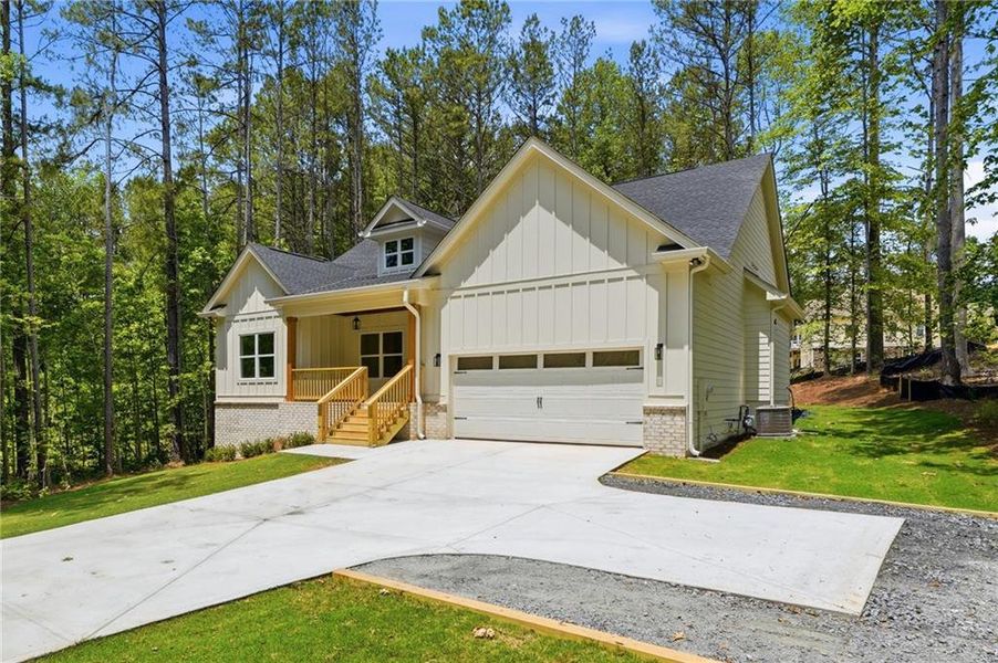 Front exterior of a new home in Autumn Brook, Canton, GA, highlighting curb appeal (Image 23). Front exterior of a new home in Autumn Brook, Canton, GA, highlighting curb appeal (Image 23).