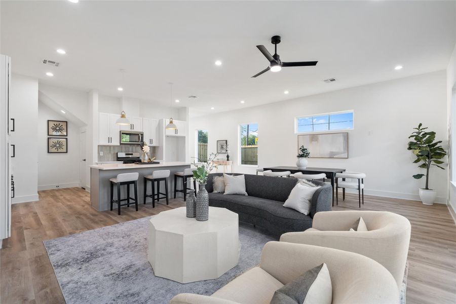 This angle showcases just how expansive the first floor is, highlighting the open layout and spacious design. Natural light flows freely throughout, emphasizing the airy, welcoming atmosphere. The generous space makes it easy to imagine daily life, entertaining, and gatherings in comfort.