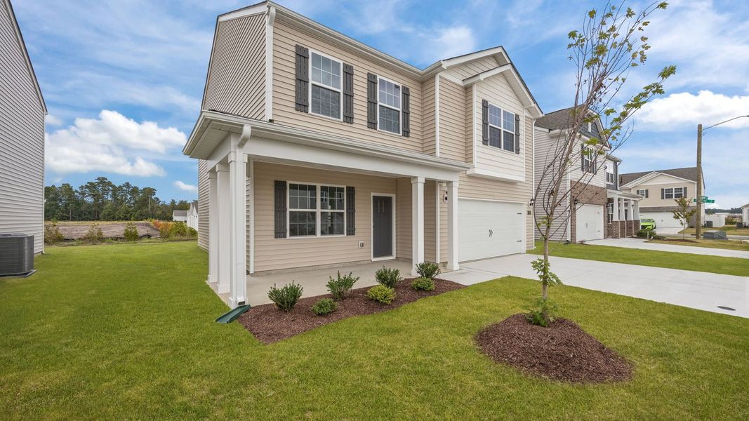 Front exterior of a new home in Ridgewood Farms, Winterville, NC, highlighting curb appeal (Image 17).