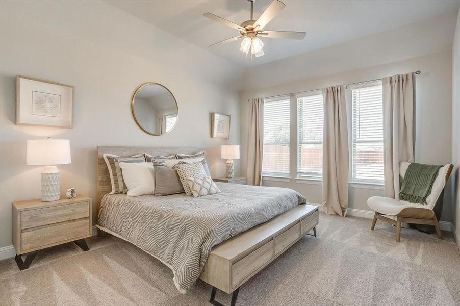 Bedroom featuring ceiling fan and light carpet