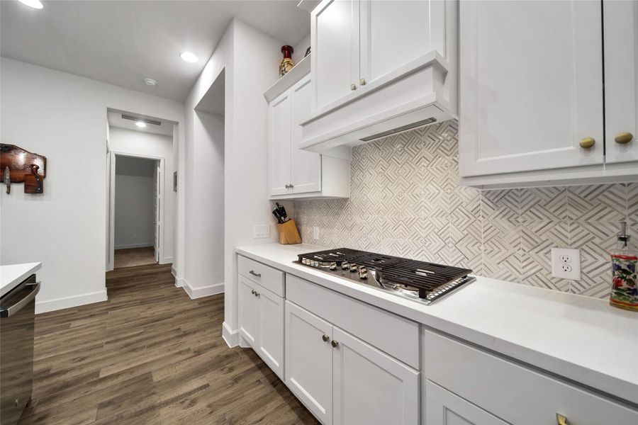 Abundant cabinetry provides storage with plenty of room to keep everything organized and accessible. Beautiful cabinet hardware added for a polished finishing touch.