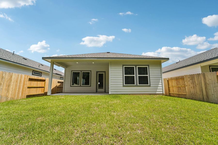 Front exterior of a new home in Landing Meadows - Traditional Series, New Caney, TX, highlighting curb appeal (Image 26). Front exterior of a new home in Landing Meadows - Traditional Series, New Caney, TX, highlighting curb appeal (Image 26).
