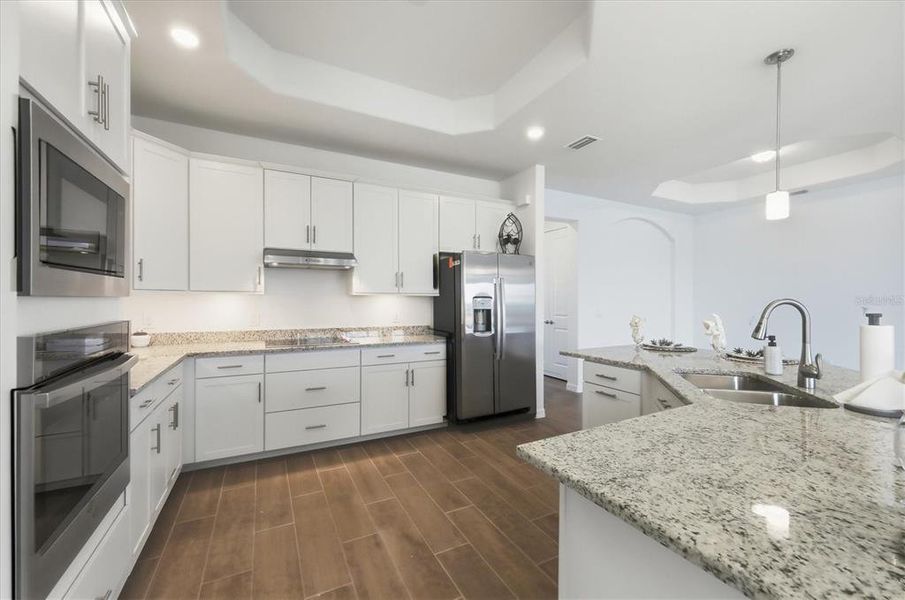 Furnished interior view inside a new home in Heritage Landing, Punta Gorda (Image 11).