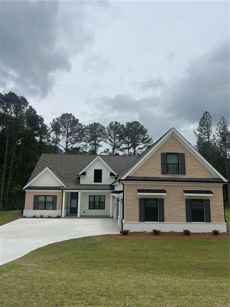 Front exterior of a new home in , Loganville, GA, highlighting curb appeal (Image 1). Front exterior of a new home in , Loganville, GA, highlighting curb appeal (Image 1).