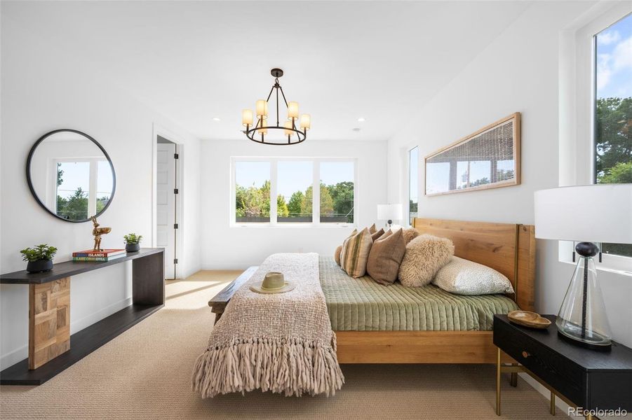 Spacious primary suite with 5 piece ensuite bath and large walk-in closet