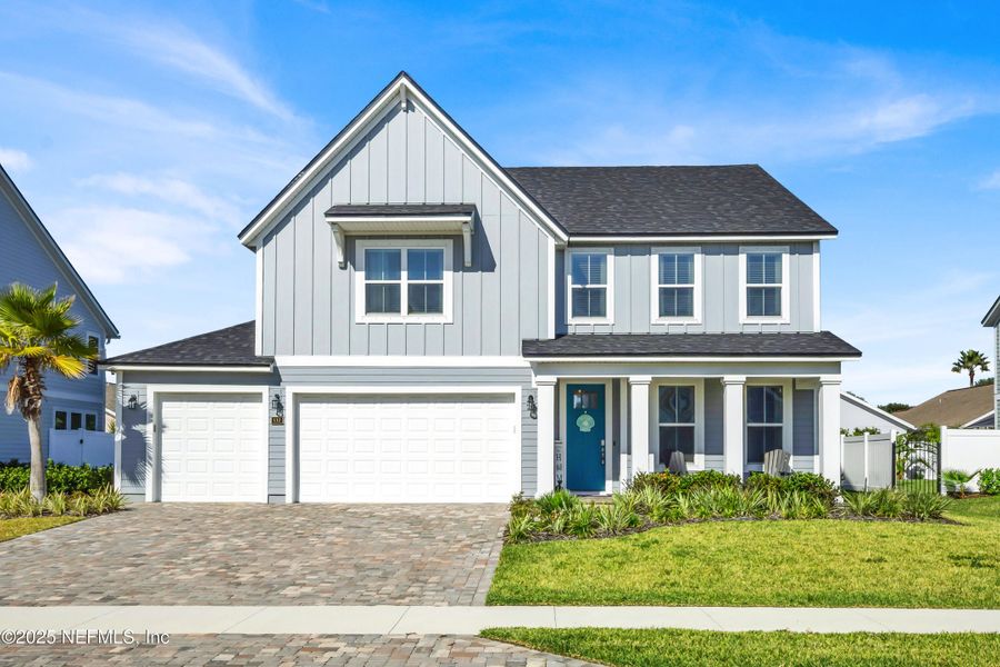 Front exterior of a new home in Seaside Vista, St. Augustine, FL, highlighting curb appeal (Image 29). Front exterior of a new home in Seaside Vista, St. Augustine, FL, highlighting curb appeal (Image 29).