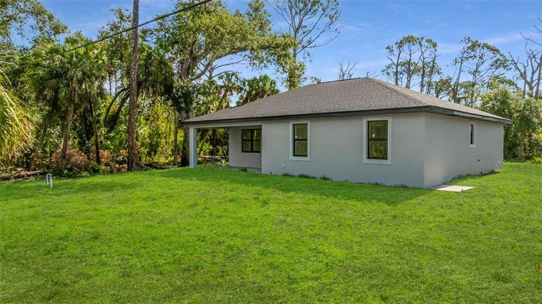 Exterior details and patio area of a home in , Port Charlotte (Image 3).