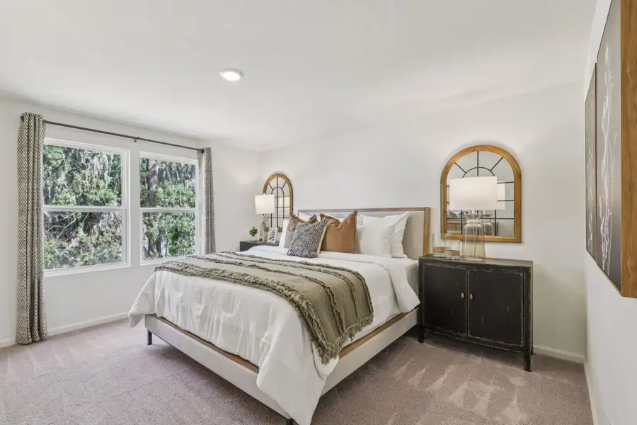 A bedroom with a large bed.