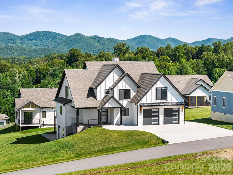Front exterior of a new home in , Candler, NC, highlighting curb appeal (Image 1). Front exterior of a new home in , Candler, NC, highlighting curb appeal (Image 1).