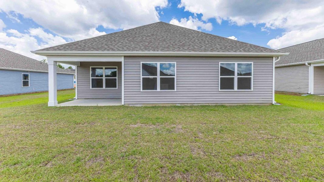 Exterior details and patio area of a home in Cedar Hill Landing, Navassa (Image 15).