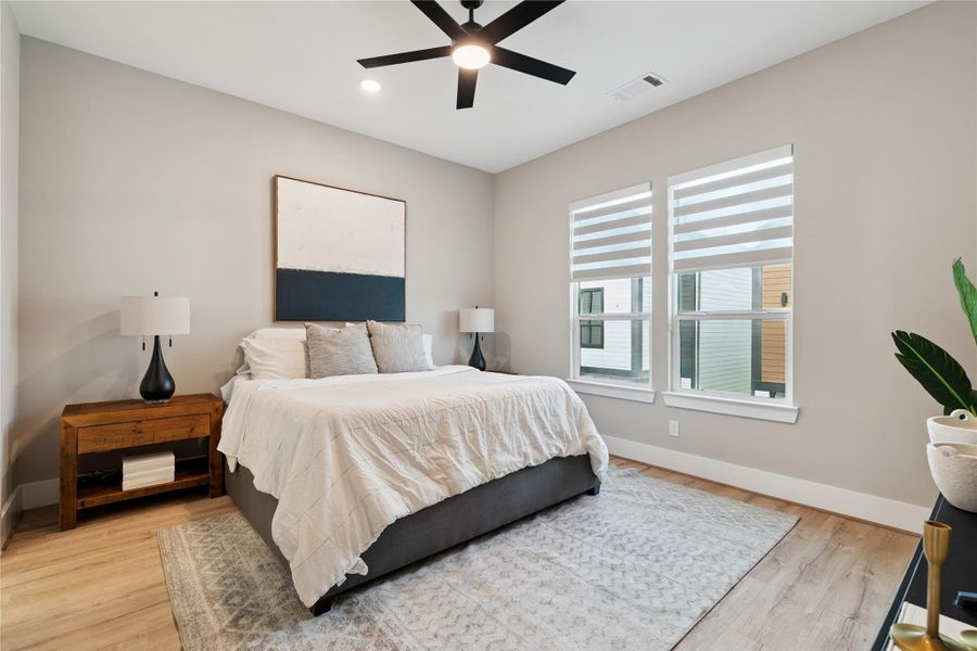 Calm and composed, the primary suite relies on light, height, and clean edges to establish a sense of retreat.