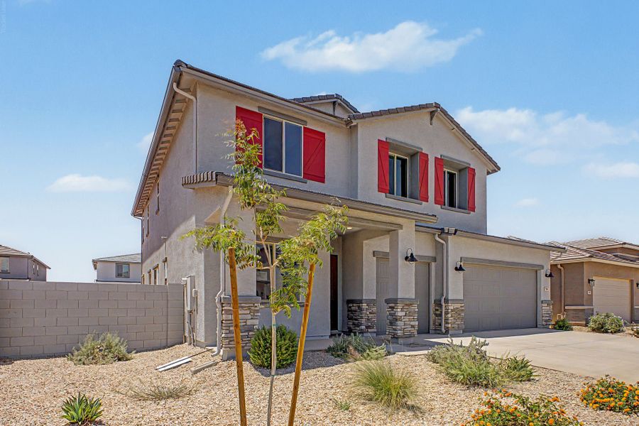 Front exterior of a new home in Wildera, San Tan Valley, AZ, highlighting curb appeal (Image 2). Front exterior of a new home in Wildera, San Tan Valley, AZ, highlighting curb appeal (Image 2).