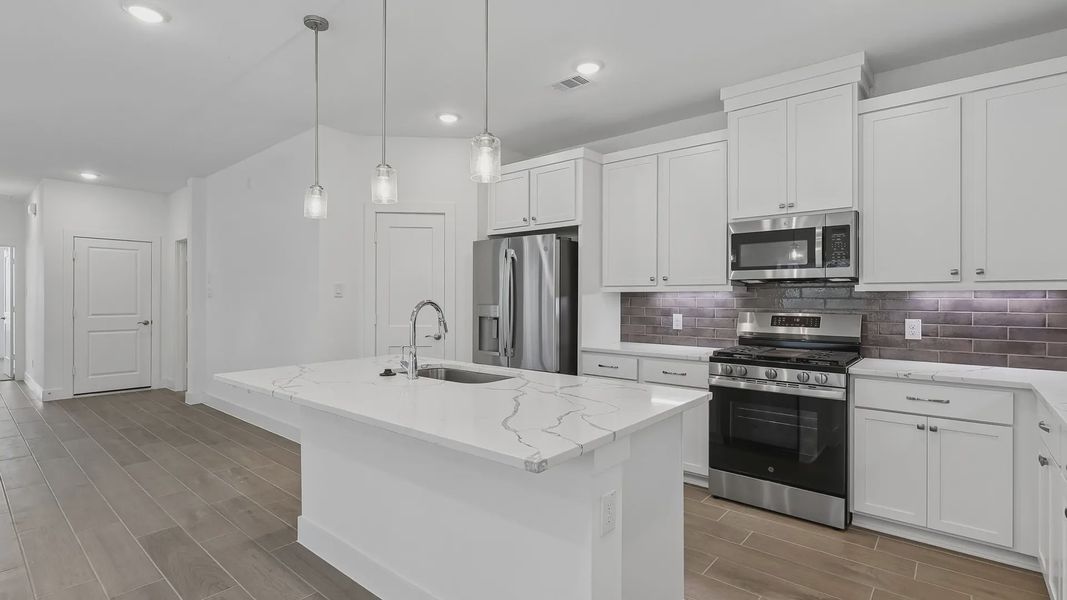 Furnished interior view inside a new home in Meridiana Townhomes, Iowa Colony (Image 7).