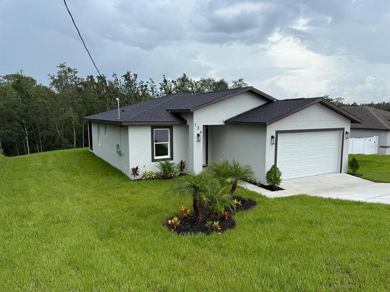 Front exterior of a new home in , Spring Hill, FL, highlighting curb appeal (Image 28). Front exterior of a new home in , Spring Hill, FL, highlighting curb appeal (Image 28).