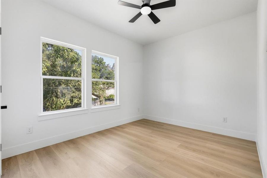 Front Rd facing Bedroom featuring ceiling fan and light wood-style floors