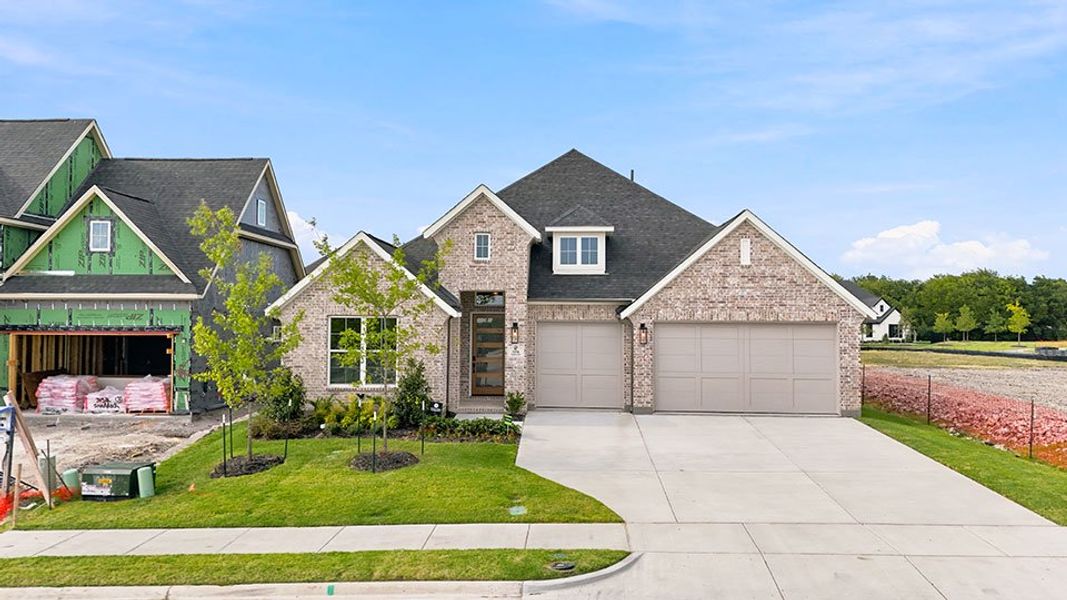 Front exterior of a new home in The Homestead - 62', Rockwall, TX, highlighting curb appeal (Image 24). Front exterior of a new home in The Homestead - 62', Rockwall, TX, highlighting curb appeal (Image 24).