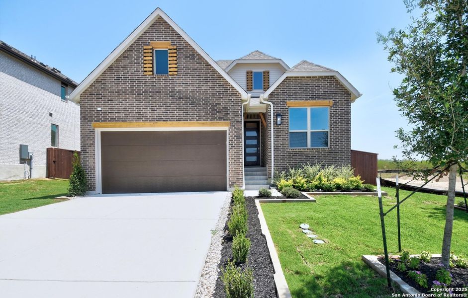 Front exterior of a new home in Homestead, Schertz, TX, highlighting curb appeal (Image 2).