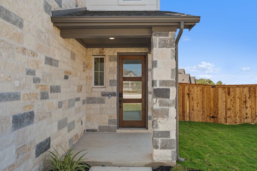 Exterior details and patio area of a home in Terrace Collection at Heritage, Dripping Springs (Image 3).