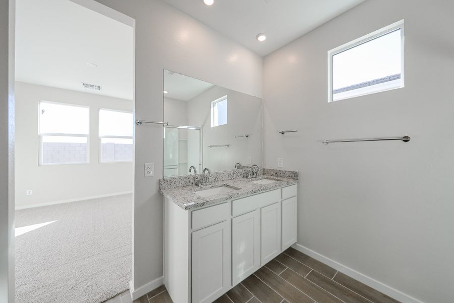 A bathroom with a marble countertop. A bathroom with a marble countertop.