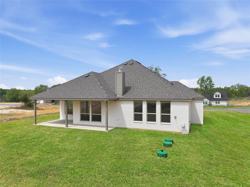Exterior details and patio area of a home in Arbor Oaks, Boyd (Image 4).