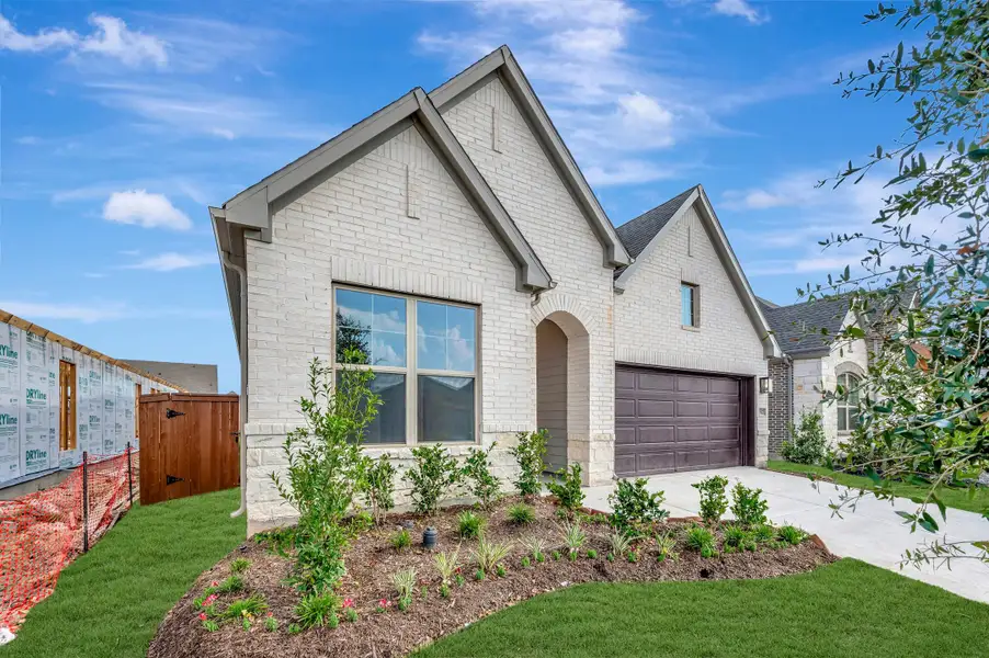 Front exterior of a new home in Meridiana - Terrace Collection, Manvel, TX, highlighting curb appeal (Image 2).