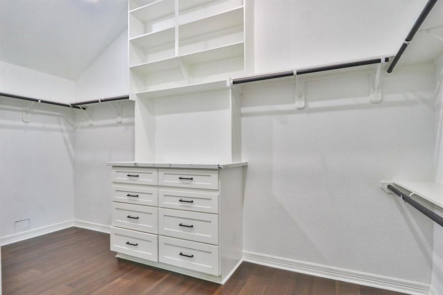 Spacious, Quality Modern Home. Custom solid wood built-in storage shelves and drawers in the primary closet.