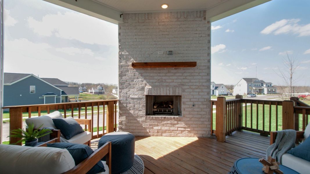 Covered indoor-outdoor seating area with fireplace Covered indoor-outdoor seating area with fireplace