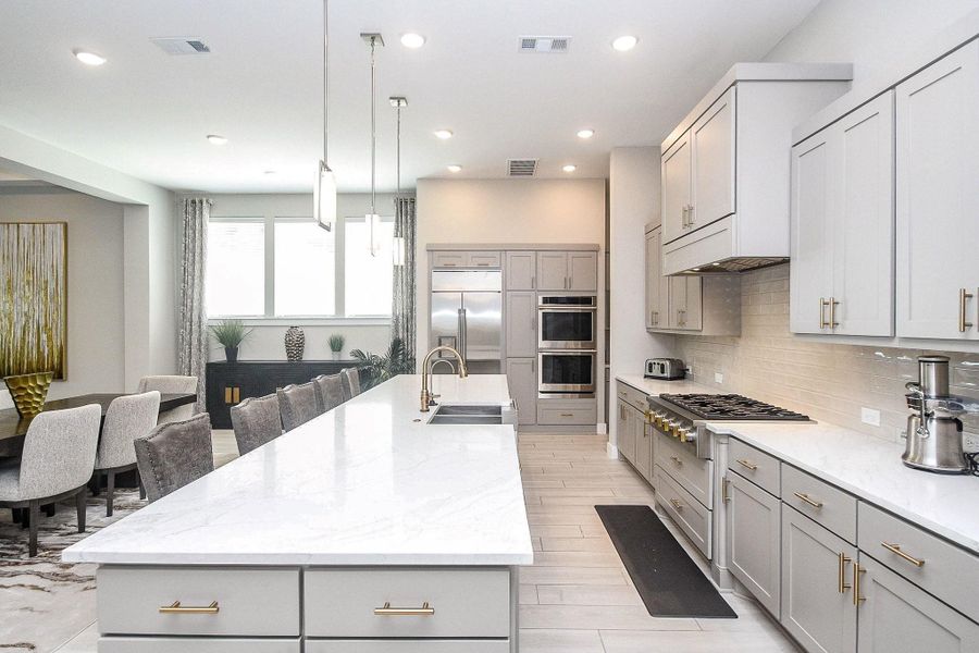 Beautiful kitchen with quartz counters, premium cabinets and drawer pulls. Beautiful kitchen with quartz counters, premium cabinets and drawer pulls.