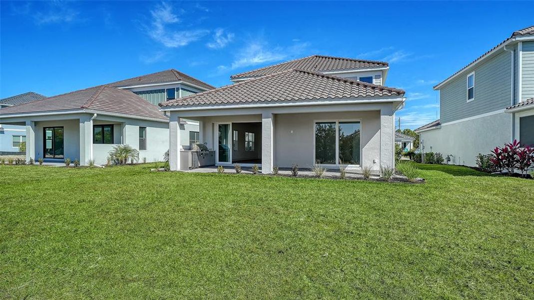 Exterior details and patio area of a home in Windward, Sarasota (Image 3).