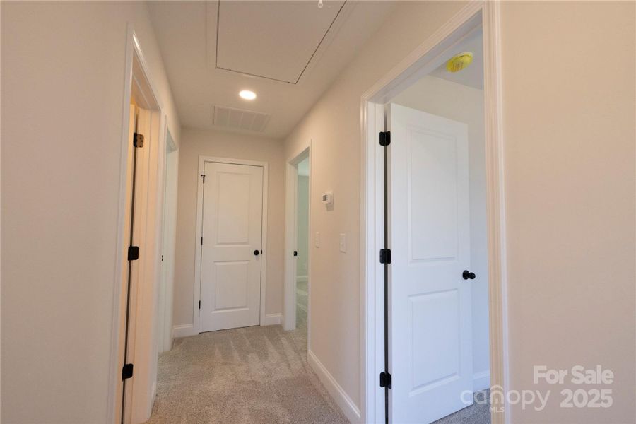 Upstairs Hallway with Pulldown Attic Stairs Upstairs Hallway with Pulldown Attic Stairs