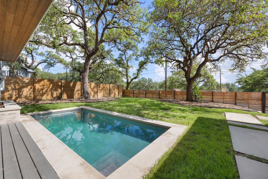 View of swimming pool featuring a patio area and a fenced backyard