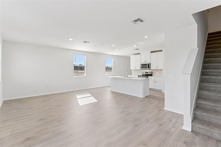 Spacious, unfurnished interior of a new home in The Reserve at Hammock Oaks Townes, Lady Lake (Image 16).