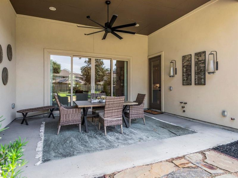 Covered Rear Patio with Fan, Gas Line, and Water Line.