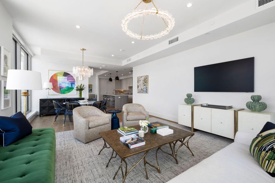 The living area effortlessly flows into the dining space and kitchen. The living area effortlessly flows into the dining space and kitchen.