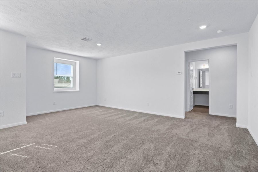 Additional Game Room views that leads you to the hallway of the secondary bedrooms and bathroom.