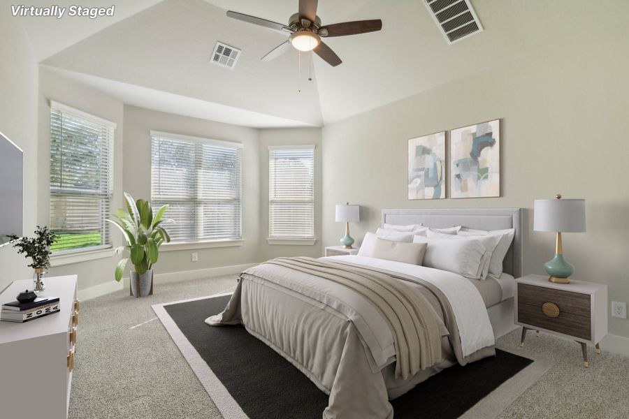 Virtually staged primary suite in the Cedar floorplan at a Meritage Homes community.