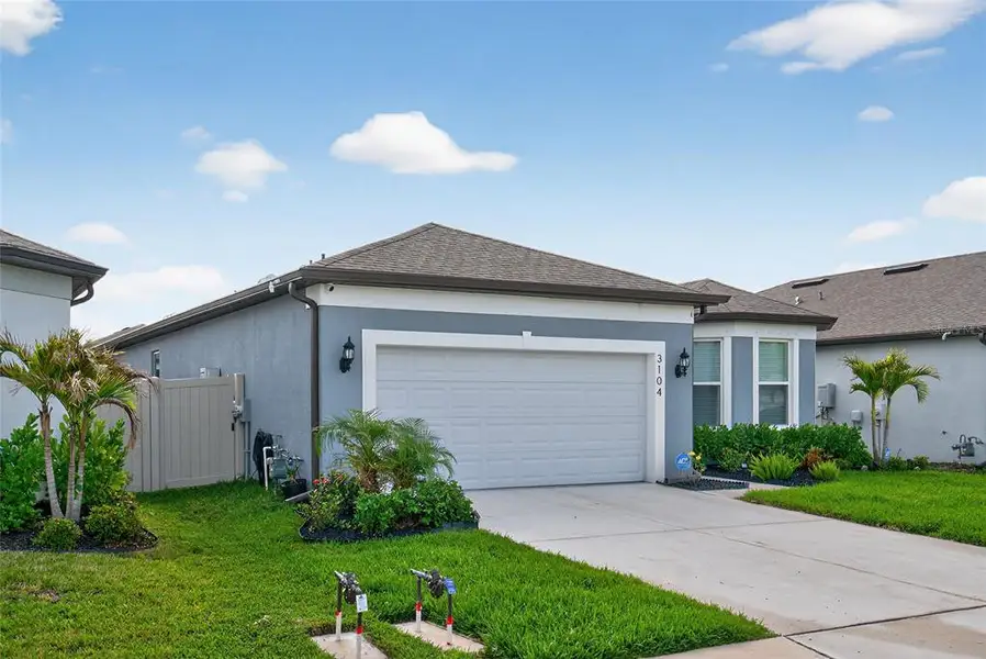Front exterior of a new home in , Ellenton, FL, highlighting curb appeal (Image 30).