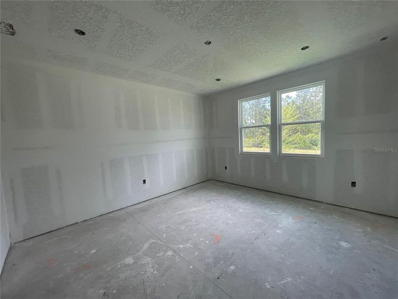 Spacious, unfurnished interior of a new home in Palm Series at Seminole Palms, Palm Coast (Image 8).
