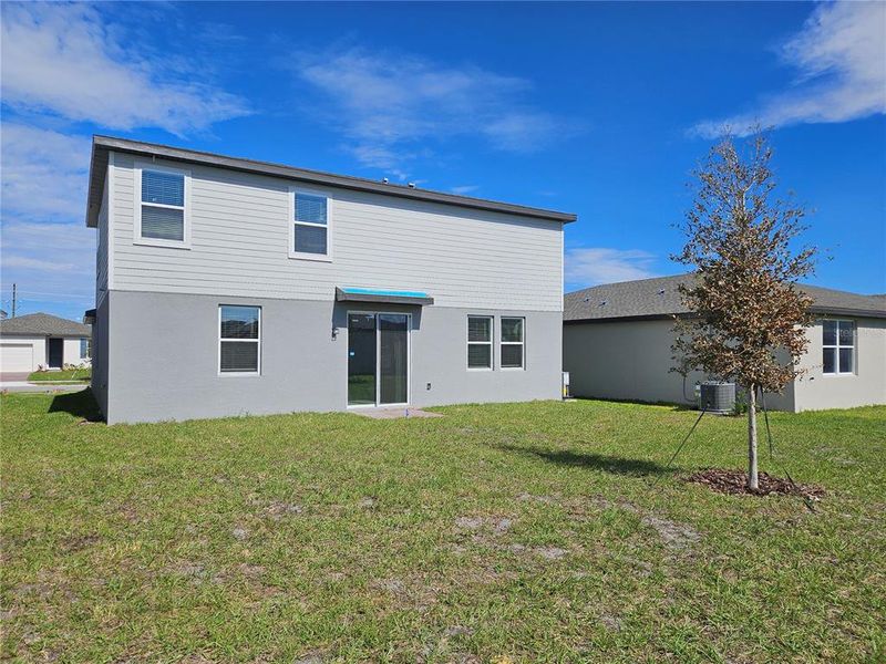 Exterior details and patio area of a home in Lawson Dunes - Signature Series, Haines City (Image 3).