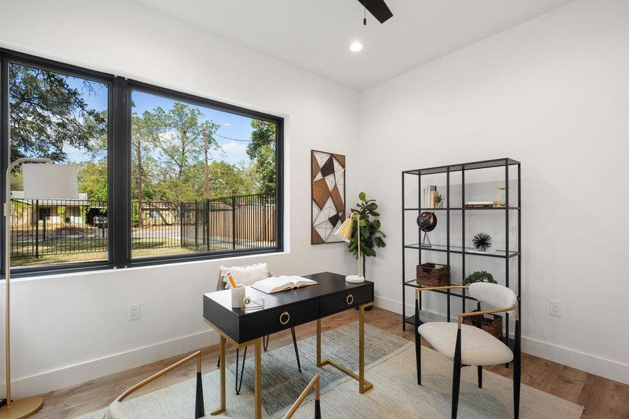 Office space featuring wood finished floors and recessed lighting