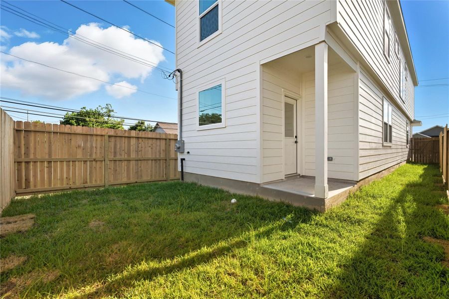 The fenced backyard provides a brand-new outdoor space that’s private, easy to maintain, and ready for you to enjoy. With room for a grill, small garden, or cozy seating area, it’s the perfect place to relax outside without the hassle of a large yard. A covered back entry adds both function and charm. The fenced backyard provides a brand-new outdoor space that’s private, easy to maintain, and ready for you to enjoy. With room for a grill, small garden, or cozy seating area, it’s the perfect place to relax outside without the hassle of a large yard. A covered back entry adds both function and charm.