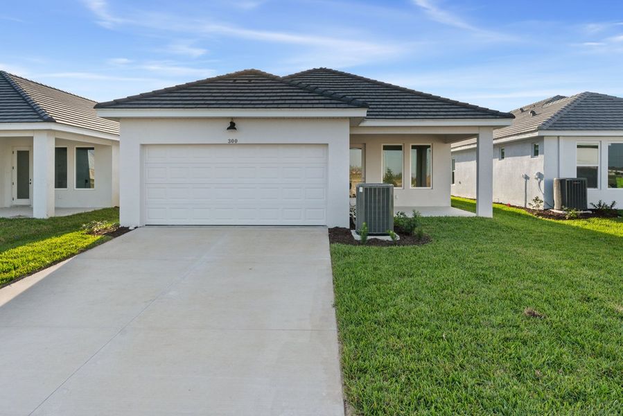 Representative exterior photo of a completed home built from the The Langham by David Weekley Homes in Vistera of Venice – Cottage Series, Nokomis, FL (Image 1).