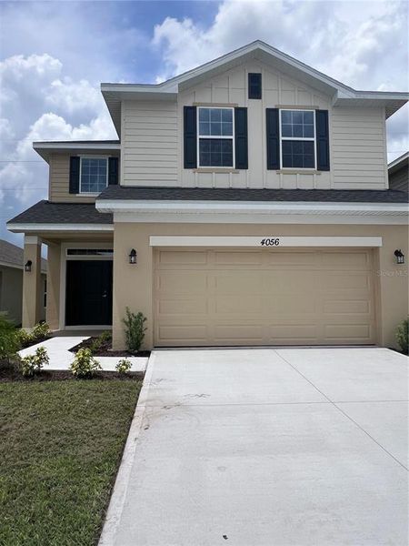 Front exterior of a new home in Harmony Central, Harmony, FL, highlighting curb appeal (Image 9). Front exterior of a new home in Harmony Central, Harmony, FL, highlighting curb appeal (Image 9).
