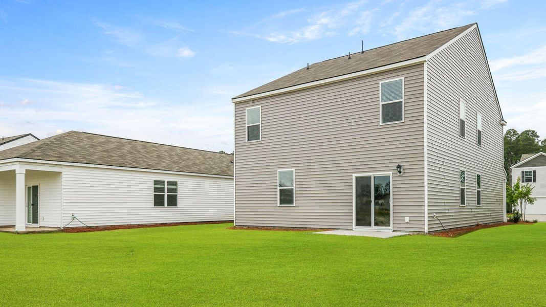 Exterior details and patio area of a home in Pine Hills at Cane Bay, Moncks Corner (Image 3).