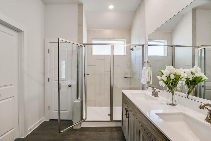Dual vanity with integral sinks and brushed nickel fixtures, under a full-width mirror