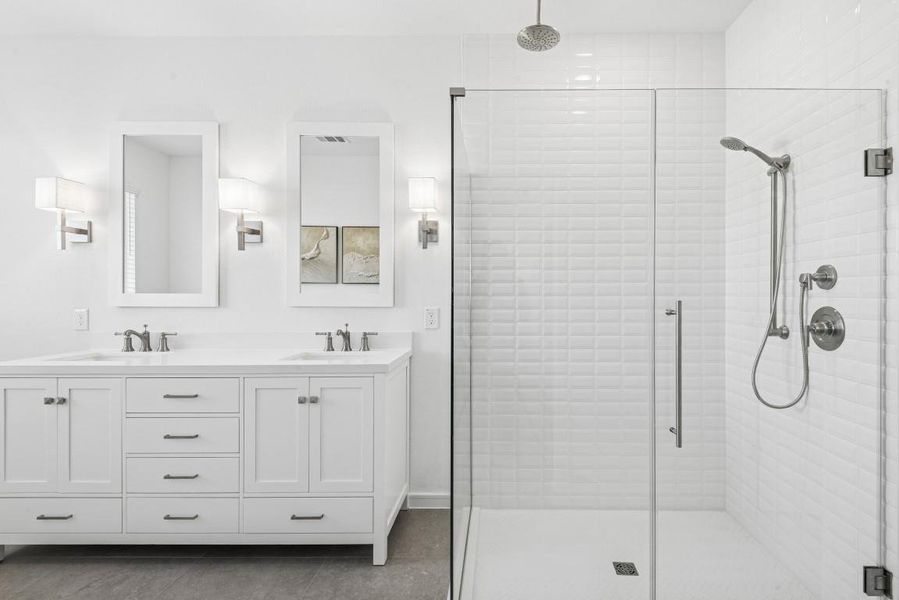 This relaxing primary bathroom features dual sinks, an amazing spa like tub, and HUGE shower! WOW! This relaxing primary bathroom features dual sinks, an amazing spa like tub, and HUGE shower! WOW!