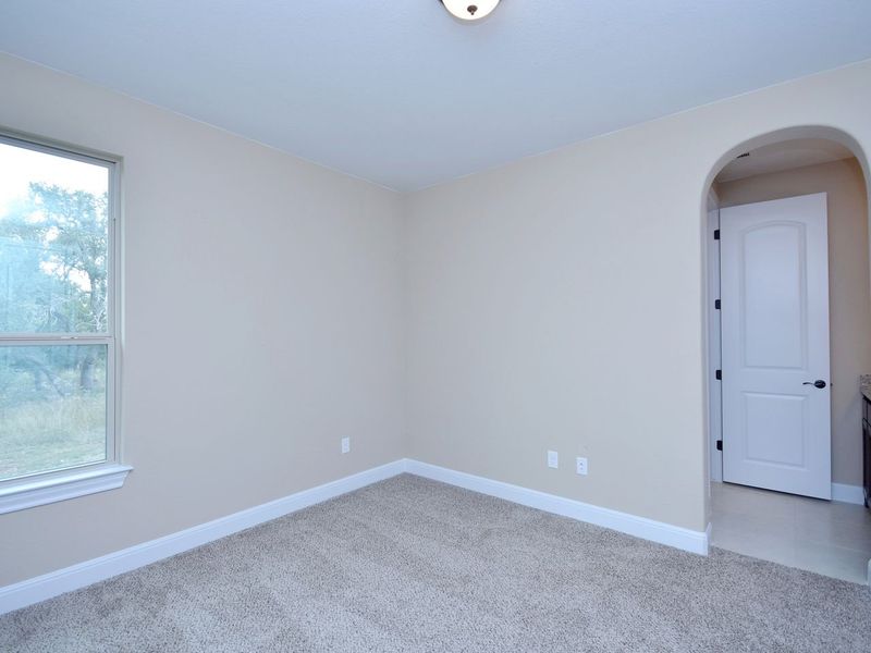 Representative unfurnished interior of a home built from the Madera II by Giddens Homes in Scofield Farms Estates, Georgetown (Image 400).